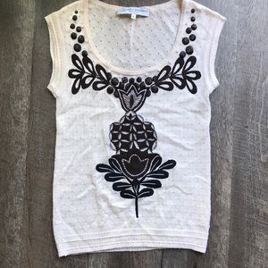 Knit Carolina Herrera sweater with appliqué.